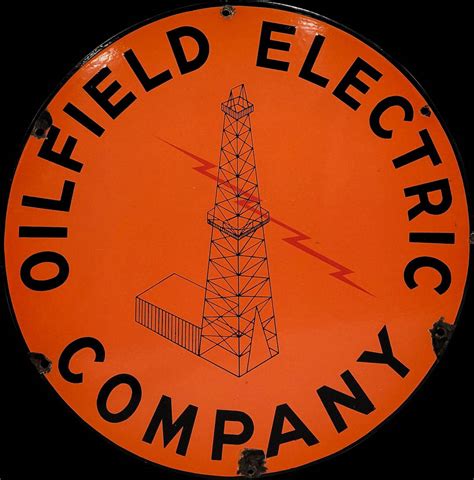 Vintage porcelain Oilfield Electric Company sign: an orange disc with an oil derrick and lightning bolt